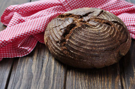 Bread on wooden background closeup.の写真素材