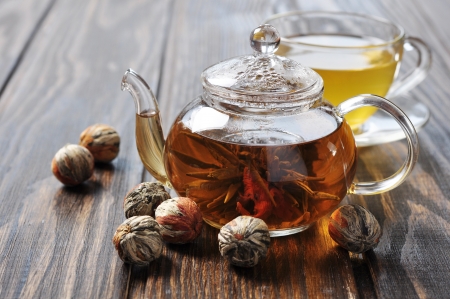 Chinese green tea with lychee in teapot on wooden backgroundの写真素材