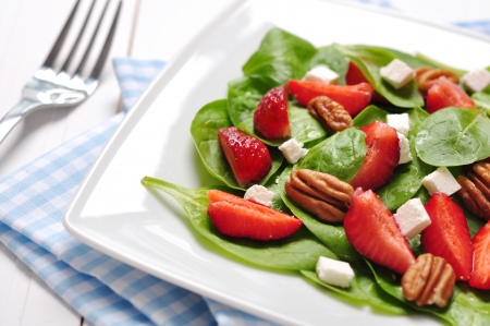 Spinach salad with strawberries, goat's cheese and pecan nutの写真素材