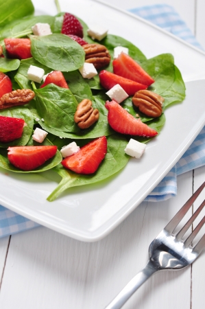 Spinach salad with strawberries, goat's cheese and pecan nutの写真素材