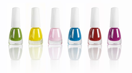 bright nail polishes isolated on white. の写真素材