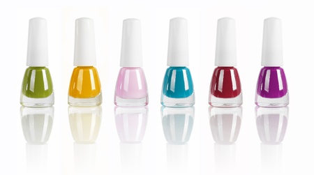 bright nail polishes isolated on white. の写真素材