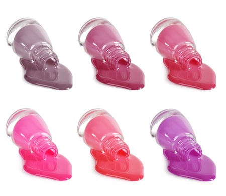 set of different colors nail polishes isolated on whiteの写真素材