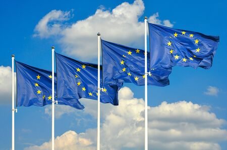 European Union flags over sky backgroundの写真素材