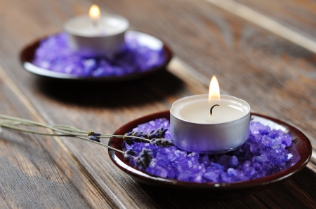 Spa background, candle with salt baths and sprigs of lavenderの写真素材