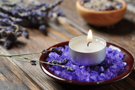 Spa background, candle with salt baths and sprigs of lavenderの写真素材