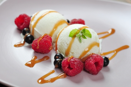 ice cream sundae with fresh raspberry and blackcurrantの写真素材