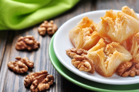Traditional Turkish arabic dessert - baklava with honey and nutsの写真素材