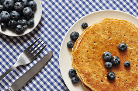 Delicious pancakes with fresh blueberries and maple syrupの写真素材