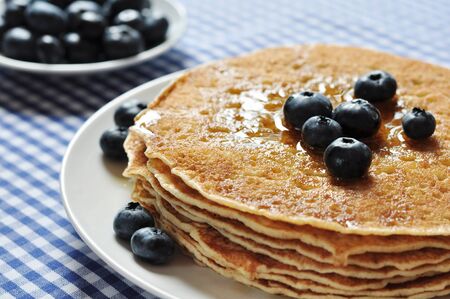 Delicious pancakes close up, with fresh blueberries and maple syrupの写真素材