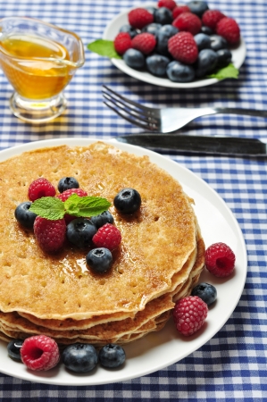 Delicious pancakes close up, with fresh blueberries, raspberry and maple syrup
pancakes with fresh berriesの写真素材