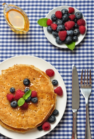 Delicious pancakes with fresh blueberries, raspberry and maple syrup
pancakes with fresh berriesの写真素材