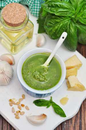 Ceramic bowl with fresh made Pesto Sauce on wooden background 
の写真素材
