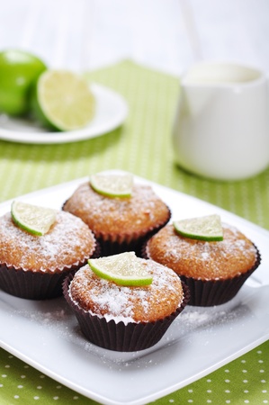 Diet muffins with bran  and fresh lime on plateの写真素材