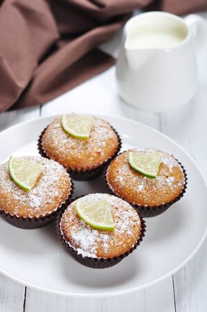 Diet muffins with bran  and fresh lime on plateの写真素材