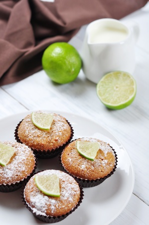 Diet muffins with bran  and fresh lime on plateの写真素材