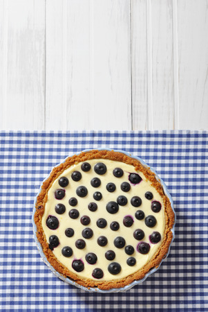 Blueberry tart on checkered background. Top view.の写真素材