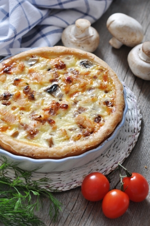 Traditional french quiche pie with chicken and mushroom  on a plateの写真素材