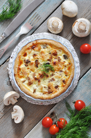 Traditional french quiche pie with chicken and mushroom  on a plateの写真素材