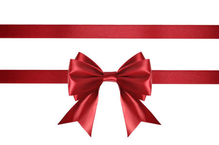 Red satin ribbon with bow isolated on white backgroundの写真素材