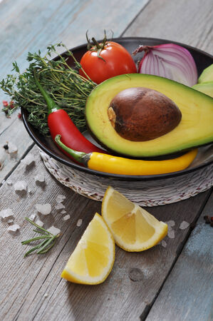 Ingredients for guacamole on vintage wooden backgroundの写真素材