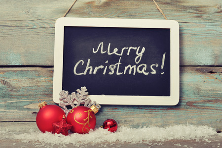 Slate board with Christmas decoration on wooden backgroundの写真素材