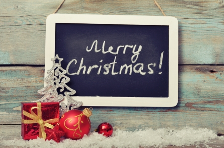 Slate board with Christmas decoration on wooden backgroundの写真素材
