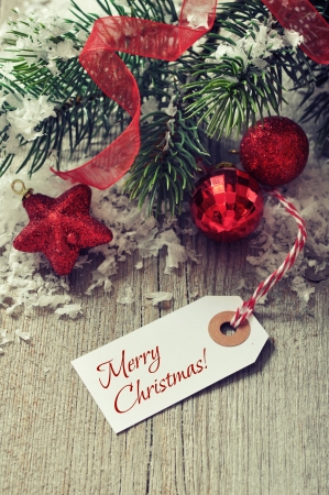 Christmas decorations  with  paper tag on wooden backgroundの写真素材
