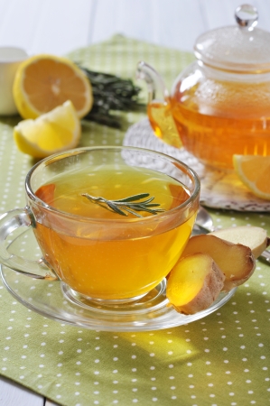 Ginger tea with lemon and rosematy in glass cup closeup.の写真素材