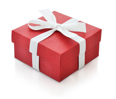 Red gift box with white ribbon isolated on white background. Clipping path included.の写真素材