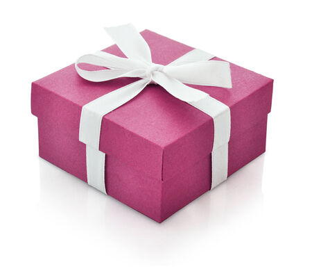 Pink gift box with white ribbon isolated on white background. Clipping path included.の写真素材