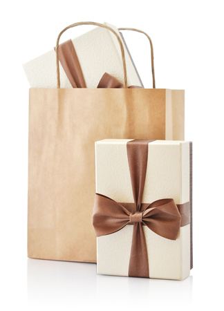 Brown paper bag with gifts isolated on a white backgroundの写真素材