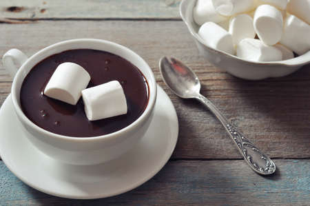 Hot chocolate with marshmallows on wooden backgroundの写真素材