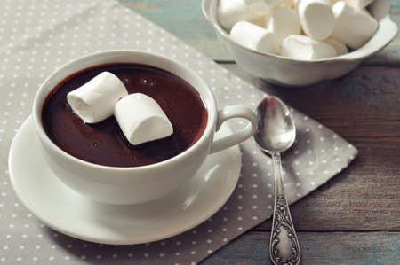 Hot chocolate with marshmallows on polka dot backgroundの写真素材