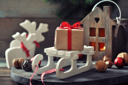 Christmas decorations with gift box on sled and  lantern on wooden の写真素材