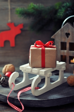 Christmas decorations with gift box on sled and  lantern on wooden の写真素材