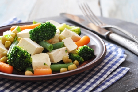 Tofu with  boiled vegetables on plate closeupの写真素材