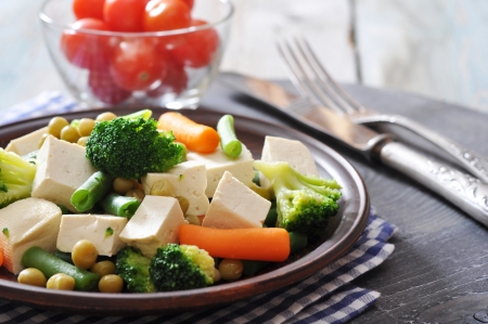 Tofu with  boiled vegetables on plate closeupの写真素材