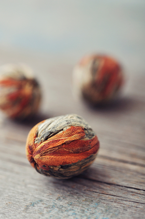 Chinese Green Tea Balls with Lychee Flower on wooden backgroundの写真素材