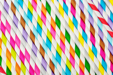 Background of Striped  drink straws in different colorsの写真素材