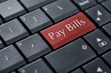Words Pay bills  on button of computer keyboard.の写真素材