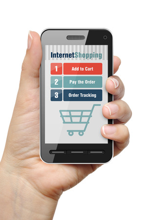 Mobile phone in female hand with internet shop appの写真素材