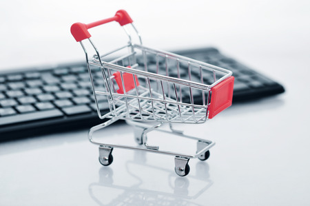 Shopping cart and keyboard on light の写真素材