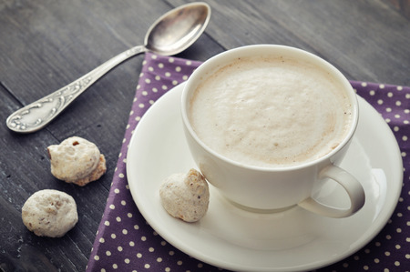 Cappuccino with  biscotti  on wooden backgroundの写真素材