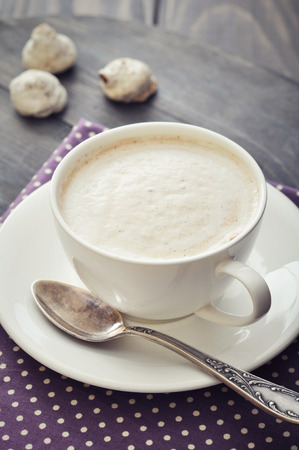 Cappuccino with  biscotti  on wooden backgroundの写真素材