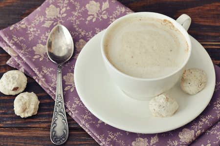Cappuccino with  biscotti  on wooden backgroundの写真素材