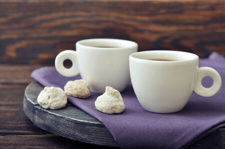 Cup of coffee with fresh biscotti  on wooden background
の写真素材