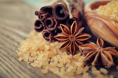 Cinnamon sticks and star anise with brown sugarの写真素材