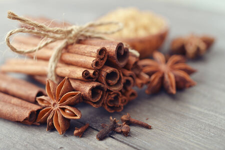 Cinnamon sticks and star anise with brown sugar closeupの写真素材