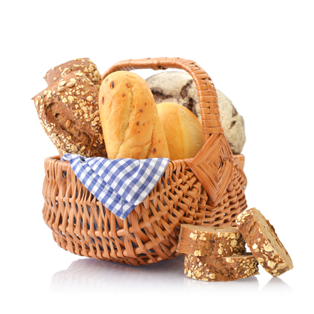 Bread and rolls in wicker basket isolated on white backgroundの写真素材